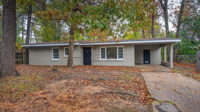 ranch-style home with a carport