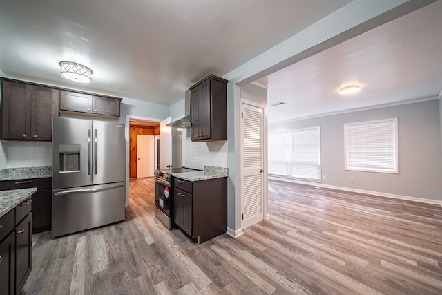 kitchen with wood-type flooring, backsplash, stainless steel appliances, and dark brown cabinets