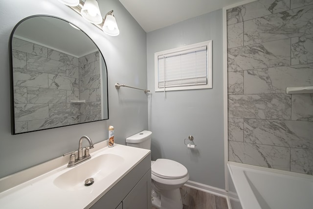 full bathroom with hardwood / wood-style flooring, vanity, toilet, and tiled shower / bath combo