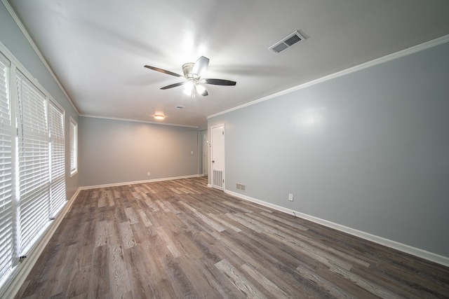 empty room with ceiling fan, ornamental molding, and hardwood / wood-style flooring