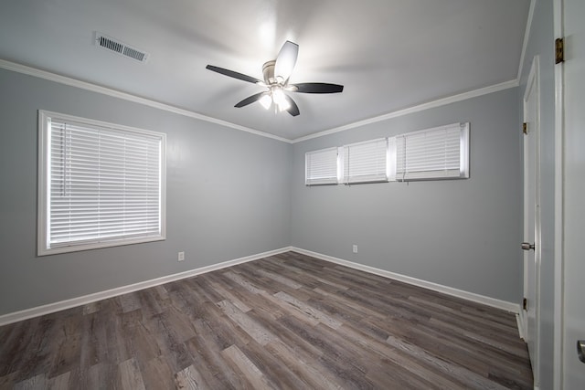 empty room with crown molding, ceiling fan, and dark wood-type flooring