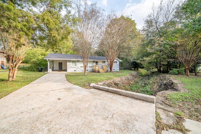 ranch-style home featuring a front yard