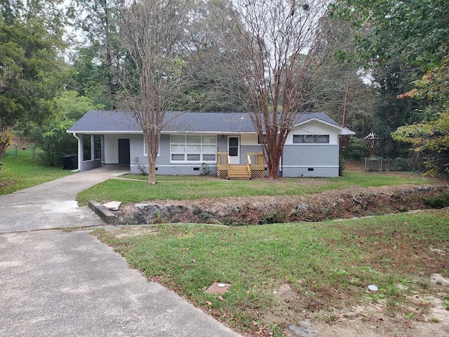 ranch-style house with a carport and a front yard