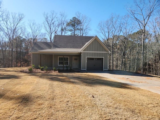 view of front facade featuring a porch and a garage