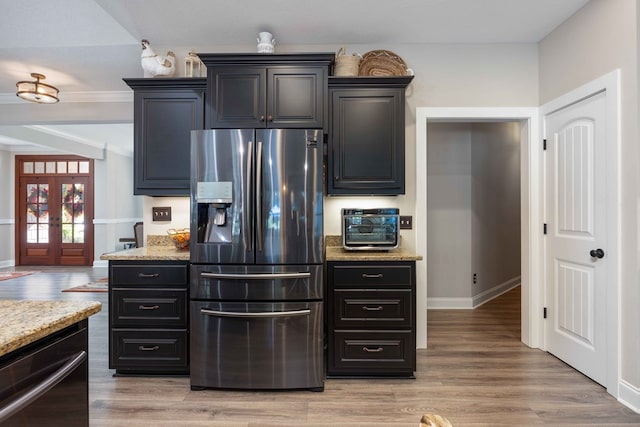 kitchen featuring french doors, stainless steel refrigerator with ice dispenser, light hardwood / wood-style flooring, light stone countertops, and black dishwasher