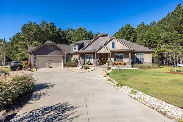 craftsman-style home featuring a garage and a front yard