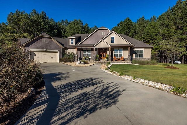 craftsman-style house with a front yard and a garage