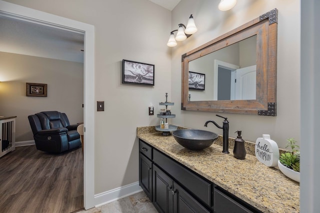 bathroom with hardwood / wood-style flooring and vanity