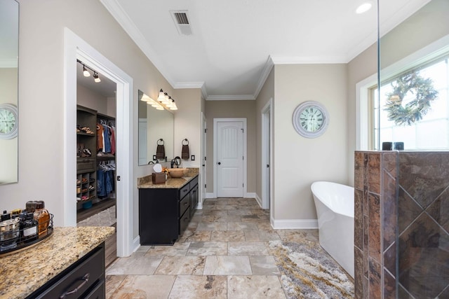 bathroom with a washtub, vanity, and ornamental molding