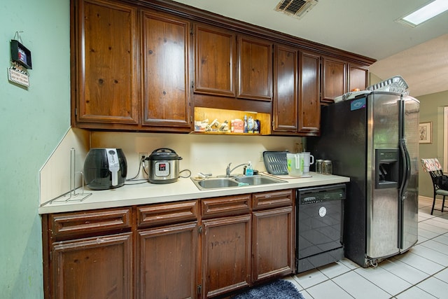 6831 Raintree Dr, Columbus, GA 31909 - kitchen featuring black dishwasher, a sink, light tile patterned floors, light countertops, and refrigerator with ice dispenser
