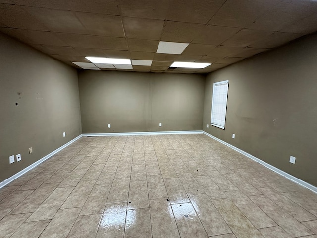 unfurnished room with a paneled ceiling