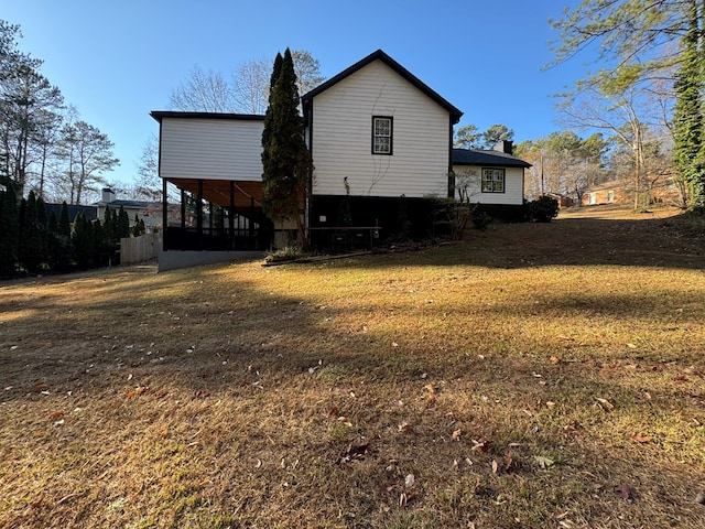 rear view of house with a yard