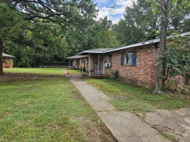 view of front of home with a front yard