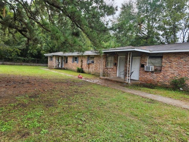 ranch-style home with a front yard