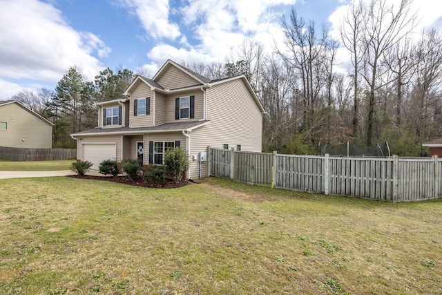 view of front of house with an attached garage, driveway, a front yard, and fence