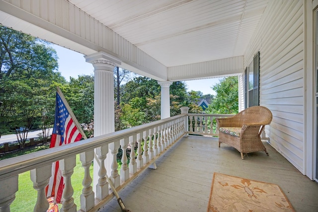 wooden terrace featuring a porch