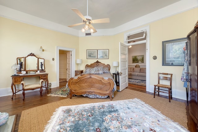 bedroom featuring connected bathroom and light hardwood / wood-style flooring