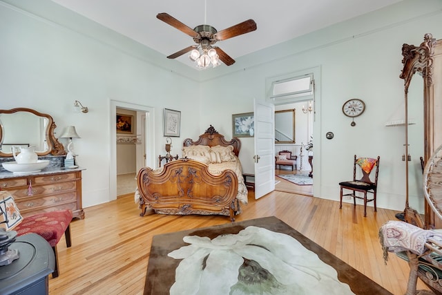 bedroom with wood-type flooring and ceiling fan