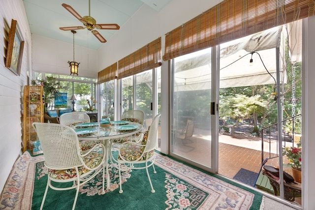 sunroom / solarium featuring ceiling fan