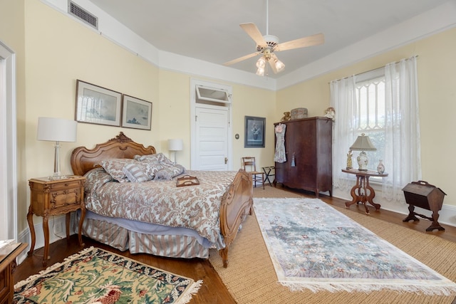 bedroom featuring hardwood / wood-style floors and ceiling fan