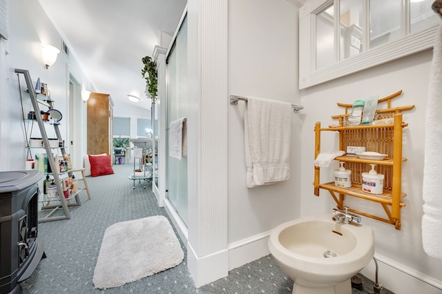 bathroom with a bidet, vanity, and walk in shower