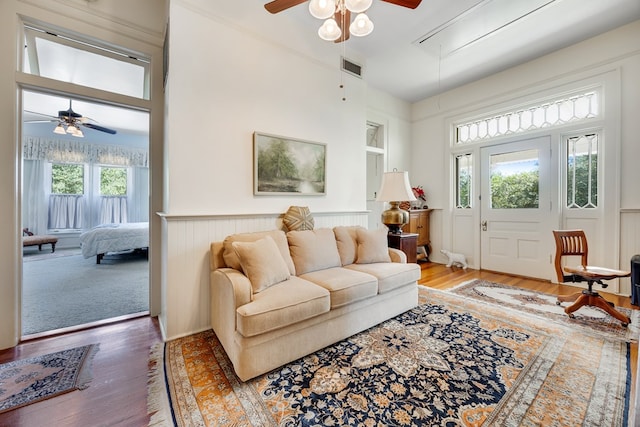 living room with hardwood / wood-style floors, plenty of natural light, and ceiling fan