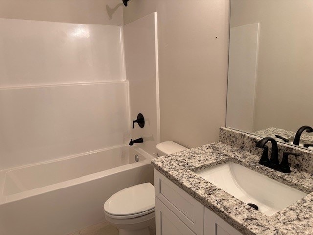 full bathroom with vanity, toilet, and washtub / shower combination