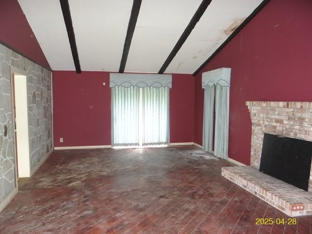 1469 Wall St, Richland, GA 31825 - unfurnished living room featuring wood finished floors, a brick fireplace, and baseboards