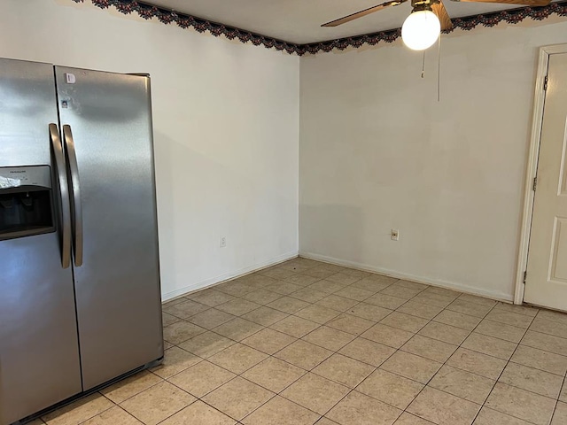 kitchen featuring light tile patterned floors, stainless steel fridge, and ceiling fan