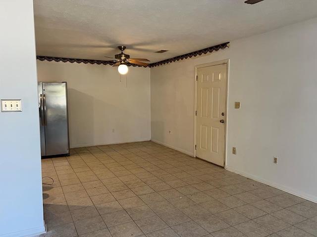 spare room with ceiling fan