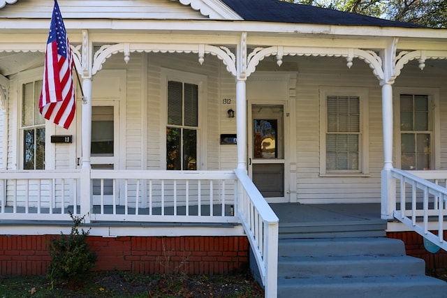 entrance to property featuring covered porch