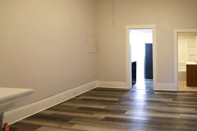 spare room with dark hardwood / wood-style flooring