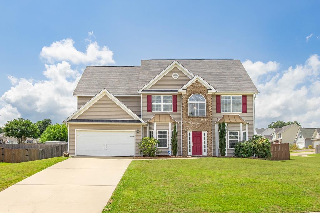 8 Oakwood Dr, Phenix City, AL 36870 - colonial home featuring concrete driveway and a garage