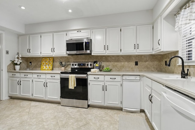 2525 Norris Rd Unit 106, Columbus, GA 31907 - kitchen with appliances with stainless steel finishes, white cabinetry, light countertops, tasteful backsplash, and recessed lighting