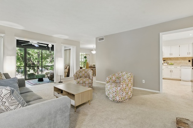 2525 Norris Rd Unit 106, Columbus, GA 31907 - living area featuring healthy amount of natural light, light colored carpet, and ceiling fan