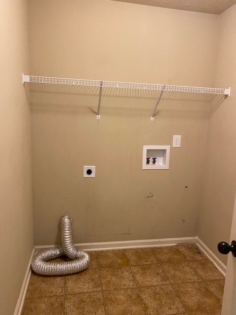 laundry area with hookup for a washing machine and hookup for an electric dryer