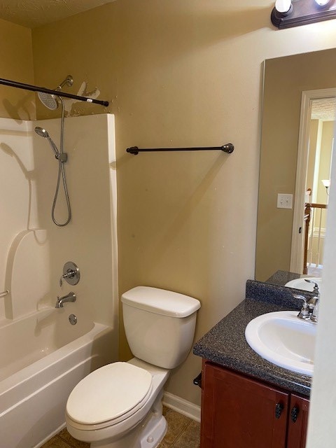 full bathroom with vanity, toilet, tile patterned floors, and shower / bathing tub combination