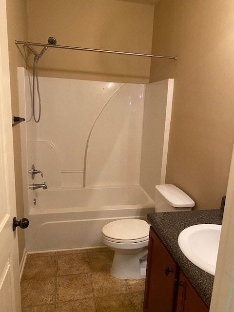 full bathroom with toilet, vanity, and bathing tub / shower combination