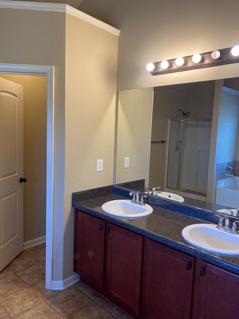 bathroom featuring crown molding, plus walk in shower, and vanity