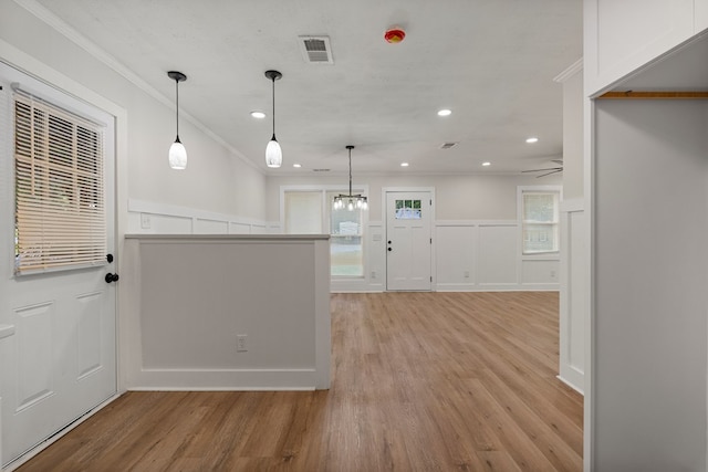 919 54th St, Columbus, GA 31904 - kitchen featuring crown molding, light wood-style flooring, recessed lighting, plenty of natural light, and a decorative wall
