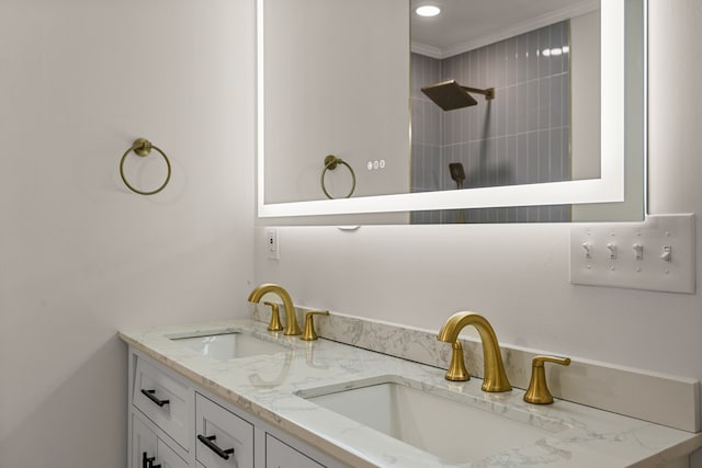 919 54th St, Columbus, GA 31904 - bathroom featuring double vanity, tiled shower, and crown molding