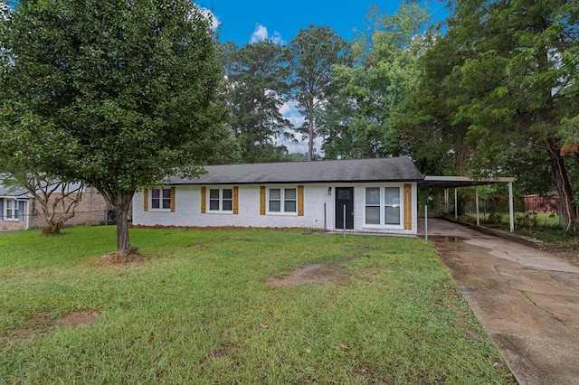 919 54th St, Columbus, GA 31904 - ranch-style house with driveway, an attached carport, a front yard, and brick siding