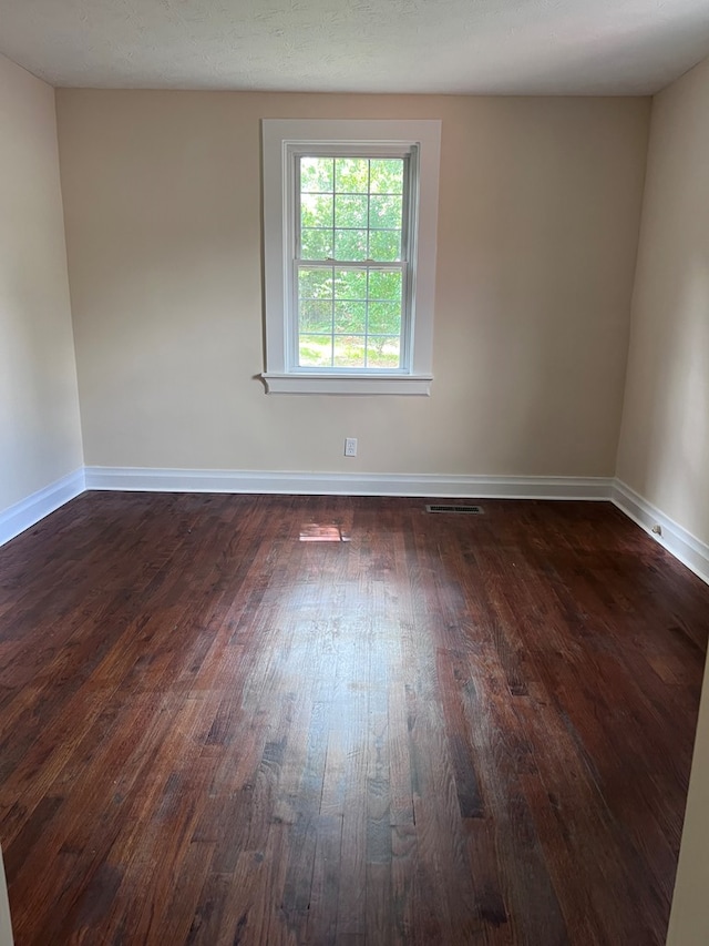4517 Sherwood Ave, Columbus, GA 31904 - spare room with dark wood-style floors and baseboards