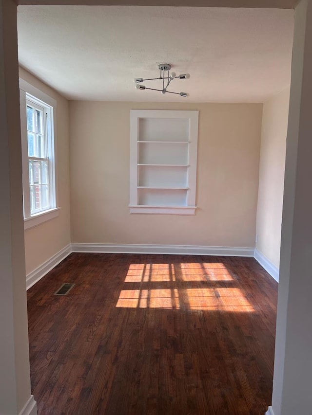 4517 Sherwood Ave, Columbus, GA 31904 - unfurnished room with built in features and dark wood-style floors