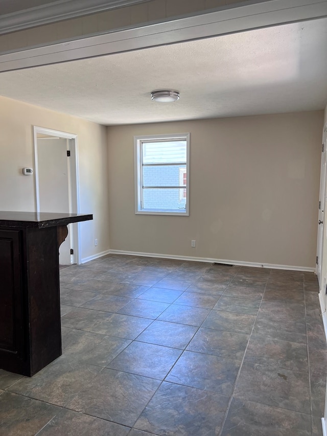 4517 Sherwood Ave, Columbus, GA 31904 - unfurnished room featuring baseboards and a textured ceiling