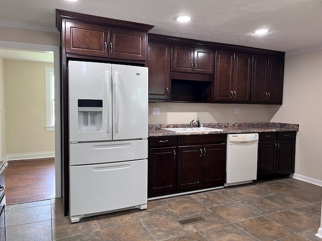 4517 Sherwood Ave, Columbus, GA 31904 - kitchen with white appliances, ornamental molding, dark brown cabinetry, and recessed lighting