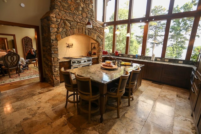 dining area featuring a high ceiling