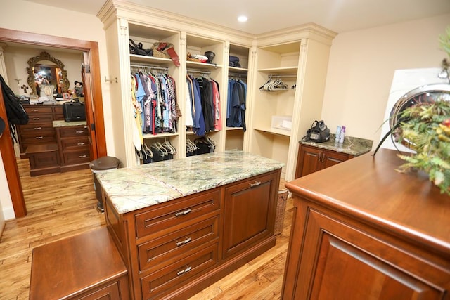 spacious closet featuring light wood-type flooring