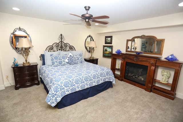 carpeted bedroom featuring ceiling fan