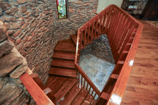 stairway featuring hardwood / wood-style floors